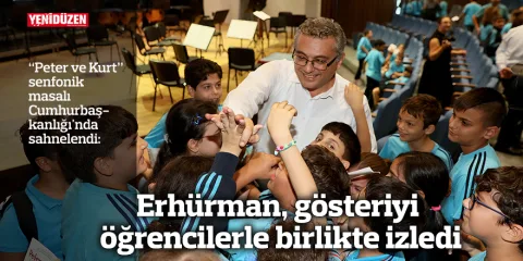 Erhürman ve öğrenciler birlikte izlerken görülüyor