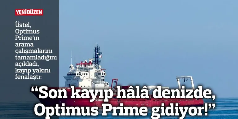 Denizde kayıp arama operasyonu; kıyıda insanlar ve bir kurtarma teknesi görünür gibi