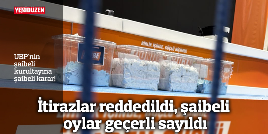 UBP kurultay salonunda kürsü ve konsey üyeleri; atmosfer gergin ve tartışmalı görünüyor